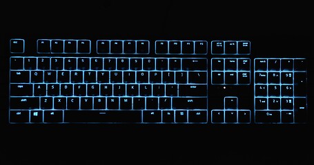 Image showing Illuminated keyboard glowing with RGB colors in the dark