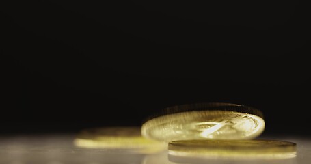 Image showing Shiny bitcoin falling down on steel surface slow motion 120 fps