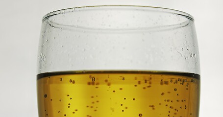 Image showing Glass of beer on the table slow motion footage