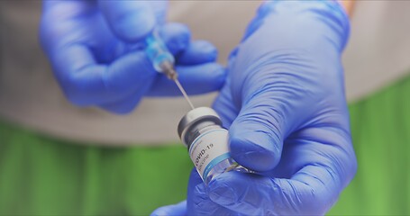 Image showing Vaccine in human hands closeup footage