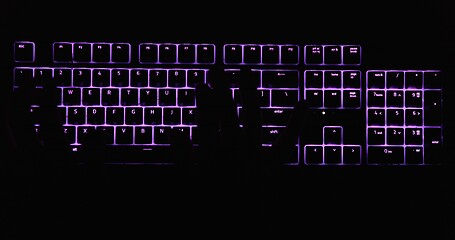 Image showing Hands typing in the dark on illuminated keyboard