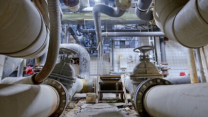 Image showing Boiler room full of pipes sliding movement motion