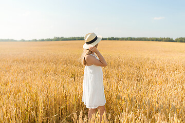 Image showing portrait of girl in straw hat on field in summer