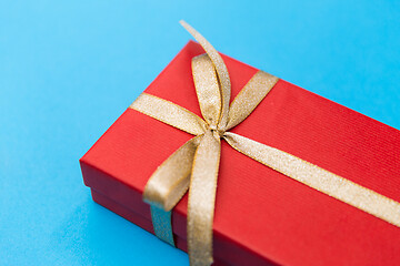 Image showing christmas red gift box on blue background