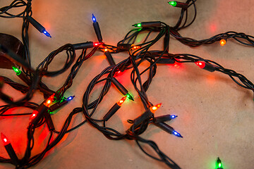 Image showing christmas garland lights on wooden background