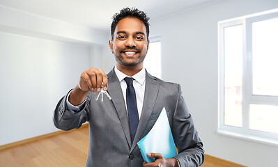 Image showing indian man realtor with home keys and folder