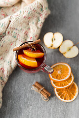 Image showing glass of hot mulled wine with orange and cinnamon