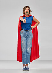 Image showing happy woman in superhero cape showing thumbs up