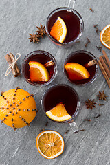 Image showing hot mulled wine, orange slices, raisins and spices