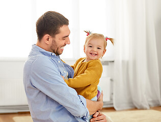 Image showing father with little baby daughter at home