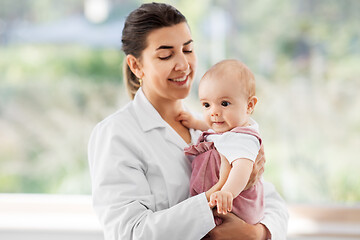 Image showing female pediatrician doctor with baby at clinic