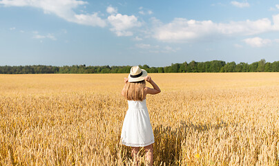 Image showing portrait of girl in straw hat on field in summer