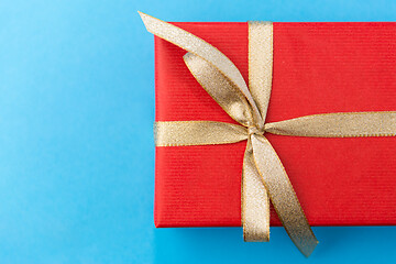 Image showing christmas red gift box on blue background