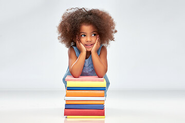 Image showing smiling little african american girl with books