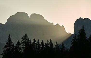 Image showing Sunrise between mountain cliffs