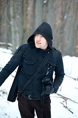 Image showing Photographer in the woods in winter