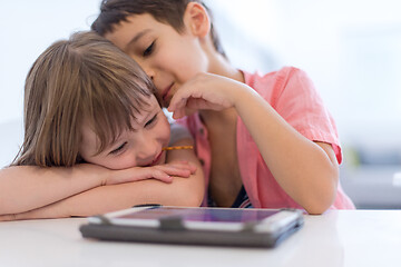 Image showing cute little brother and sister having fun at home