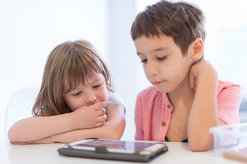 Image showing cute little brother and sister having fun at home