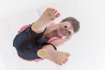 Image showing little boy standing on transparent glass floor