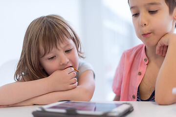 Image showing cute little brother and sister having fun at home