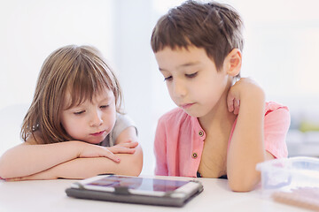 Image showing cute little brother and sister having fun at home