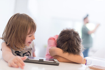 Image showing cute little brother and sister having fun at home