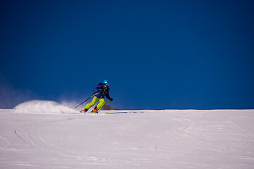 Image showing Skier having fun while running downhill