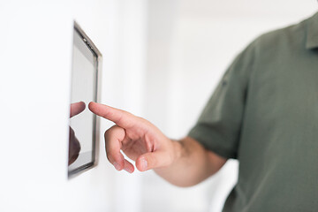 Image showing smart home and technology concept close up of male hands