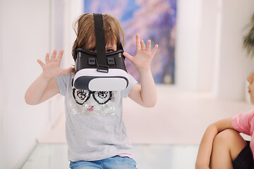 Image showing little girl at home wearing vr glasses