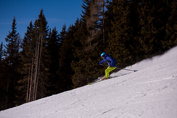 Image showing Skier having fun while running downhill