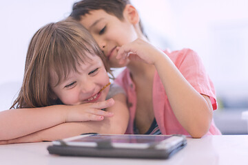 Image showing cute little brother and sister having fun at home