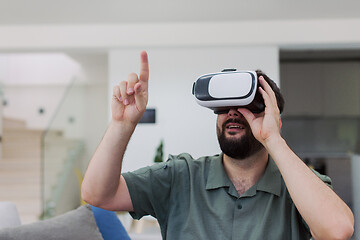 Image showing man with beard trying vr glasses