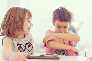 Image showing cute little brother and sister having fun at home