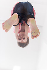 Image showing little boy standing on transparent glass floor