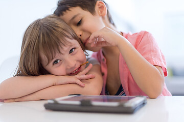 Image showing cute little brother and sister having fun at home