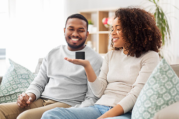 Image showing african american couple with smart speaker at home