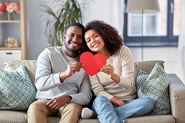 Image showing happy african american couple with heart at home