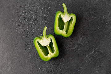 Image showing cut green pepper on slate stone background