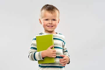 Image showing portrait of smiling boy holding book