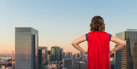 Image showing woman in red superhero cape over tokyo city