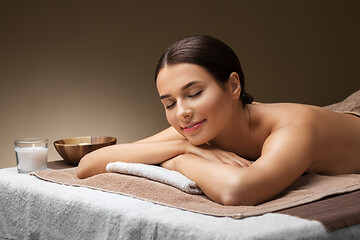 Image showing young woman lying at spa or massage parlor