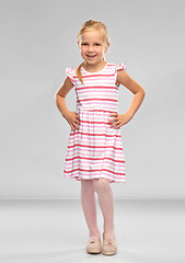 Image showing smiling little girl in striped dress