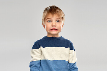 Image showing shocked little boy in striped pullover