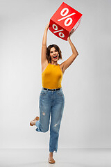 Image showing happy smiling young woman with sale sign