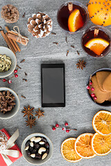 Image showing smartphone, hot mulled wine and christmas spices