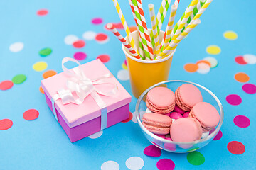 Image showing birthday gift, macarons and paper straws for party