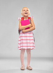 Image showing happy little student girl with school bag and book