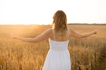 Image showing happy woman enjoying freedom on cereal field