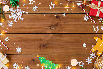 Image showing christmas gifts and decorations on wooden boards