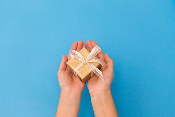 Image showing hands holding small christmas gift box